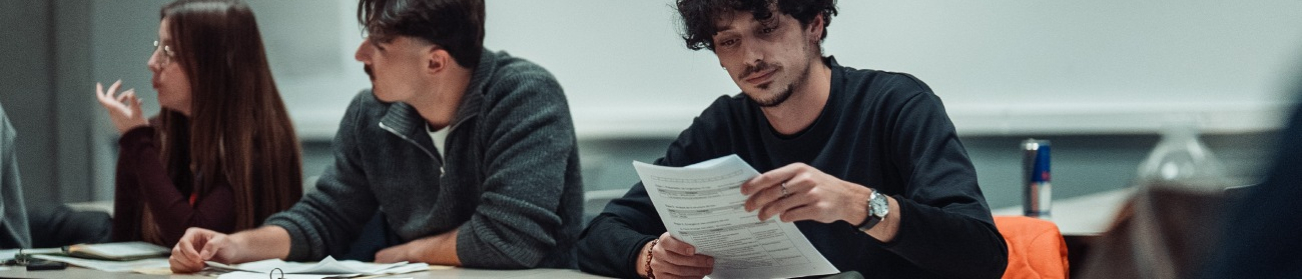 Students with sheets of paper